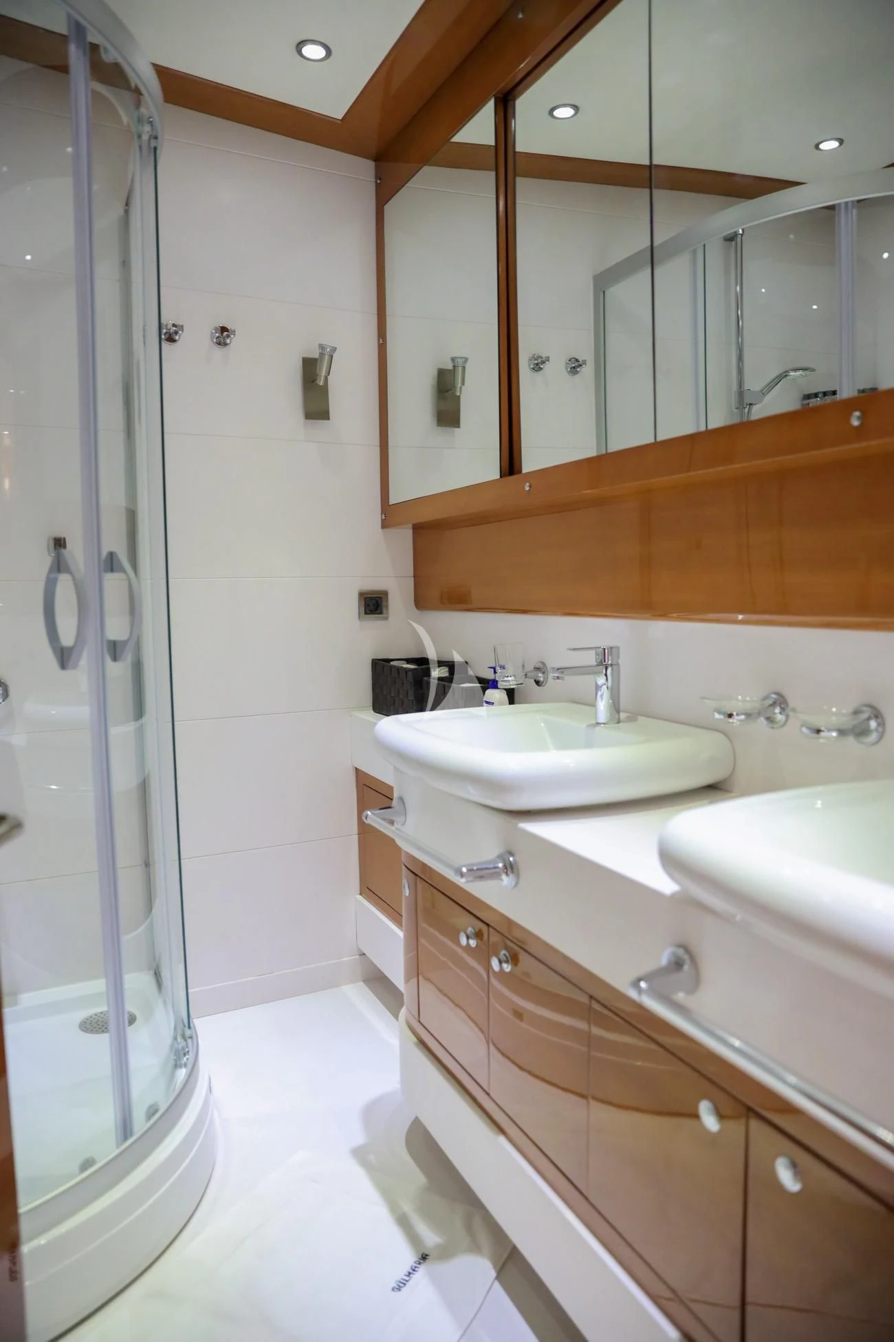 a bathroom with a sink and a mirror aboard CANARIA Yacht for Sale