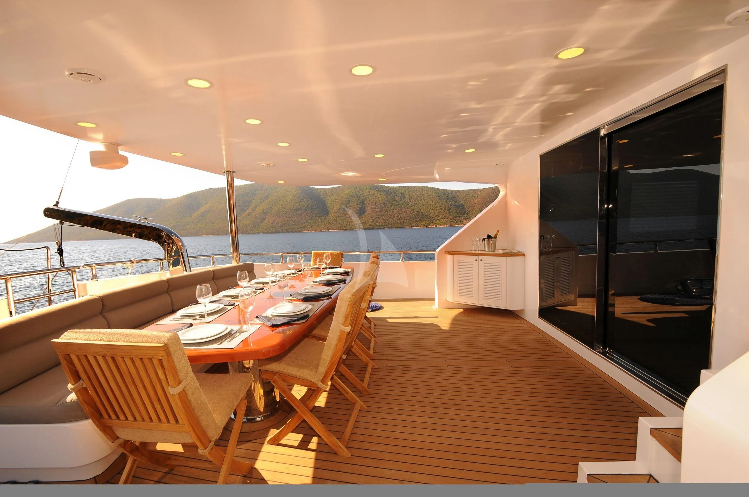 a room with a table and chairs aboard CANARIA Yacht for Sale