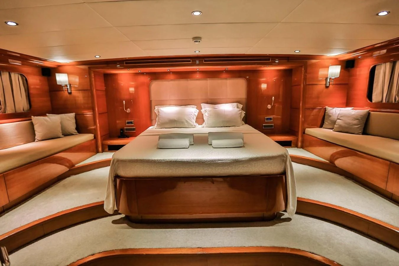 a room with a bed and a couch aboard CANARIA Yacht for Sale