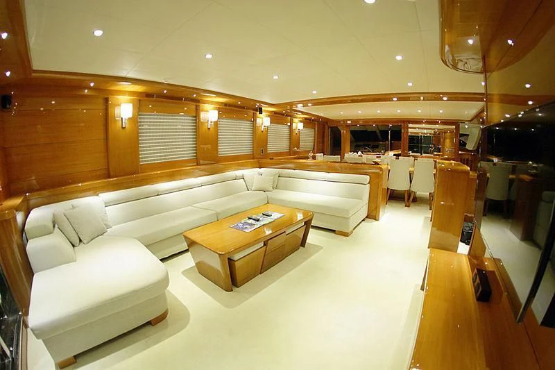 a room with a couch and a table aboard CANARIA Yacht for Sale