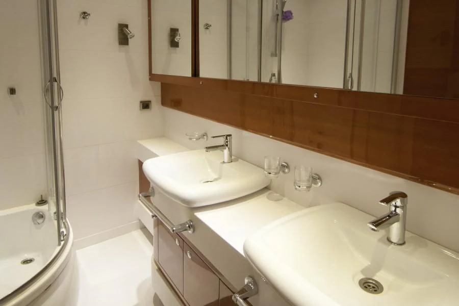 a bathroom with two sinks aboard CANARIA Yacht for Sale