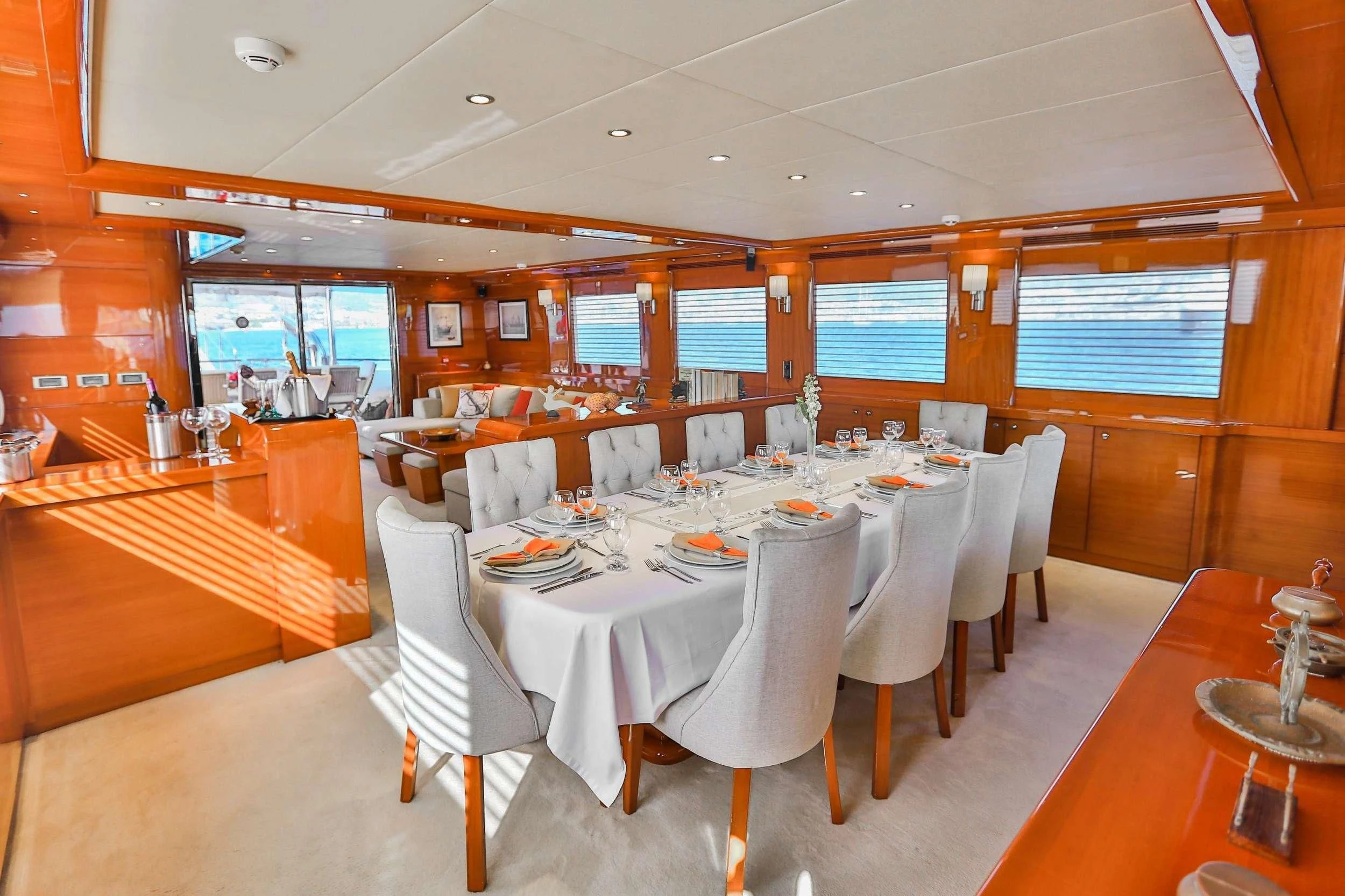 a restaurant with tables and chairs aboard CANARIA Yacht for Sale