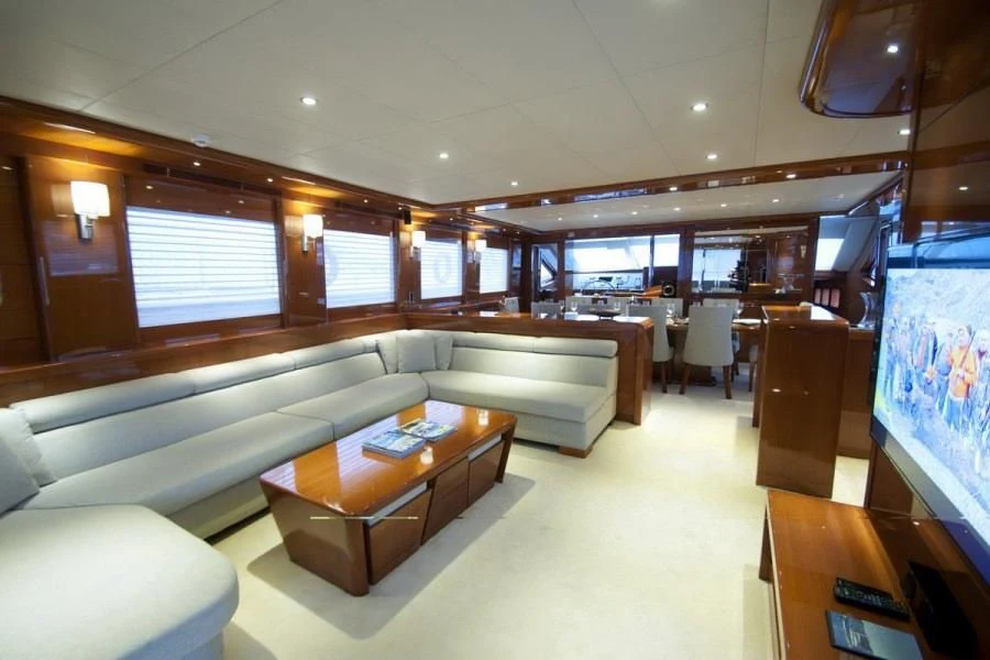 a room with a couch and a table aboard CANARIA Yacht for Sale