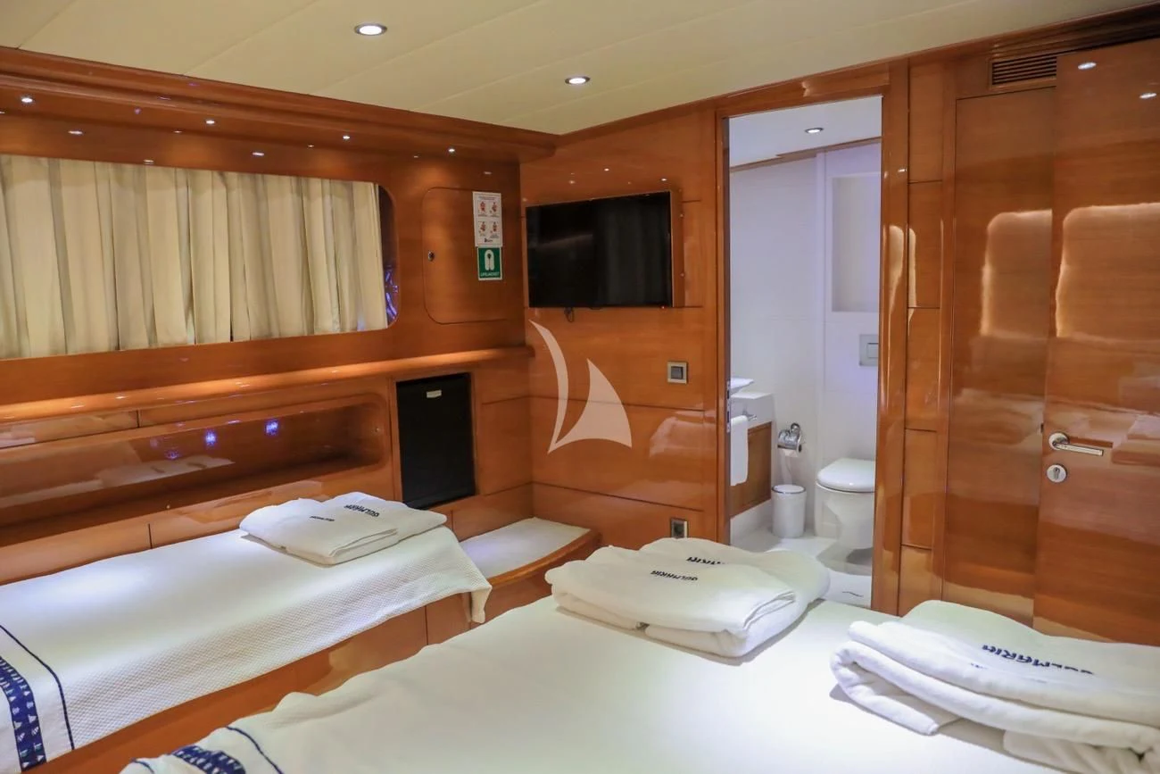 a room with a bed and a tv aboard CANARIA Yacht for Sale