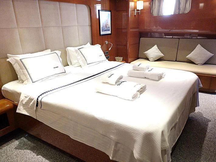 a hotel room with two beds aboard CANARIA Yacht for Sale