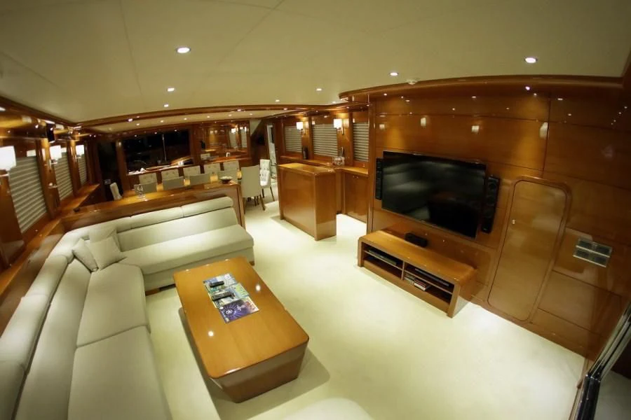 a living room with a couch and a tv aboard CANARIA Yacht for Sale