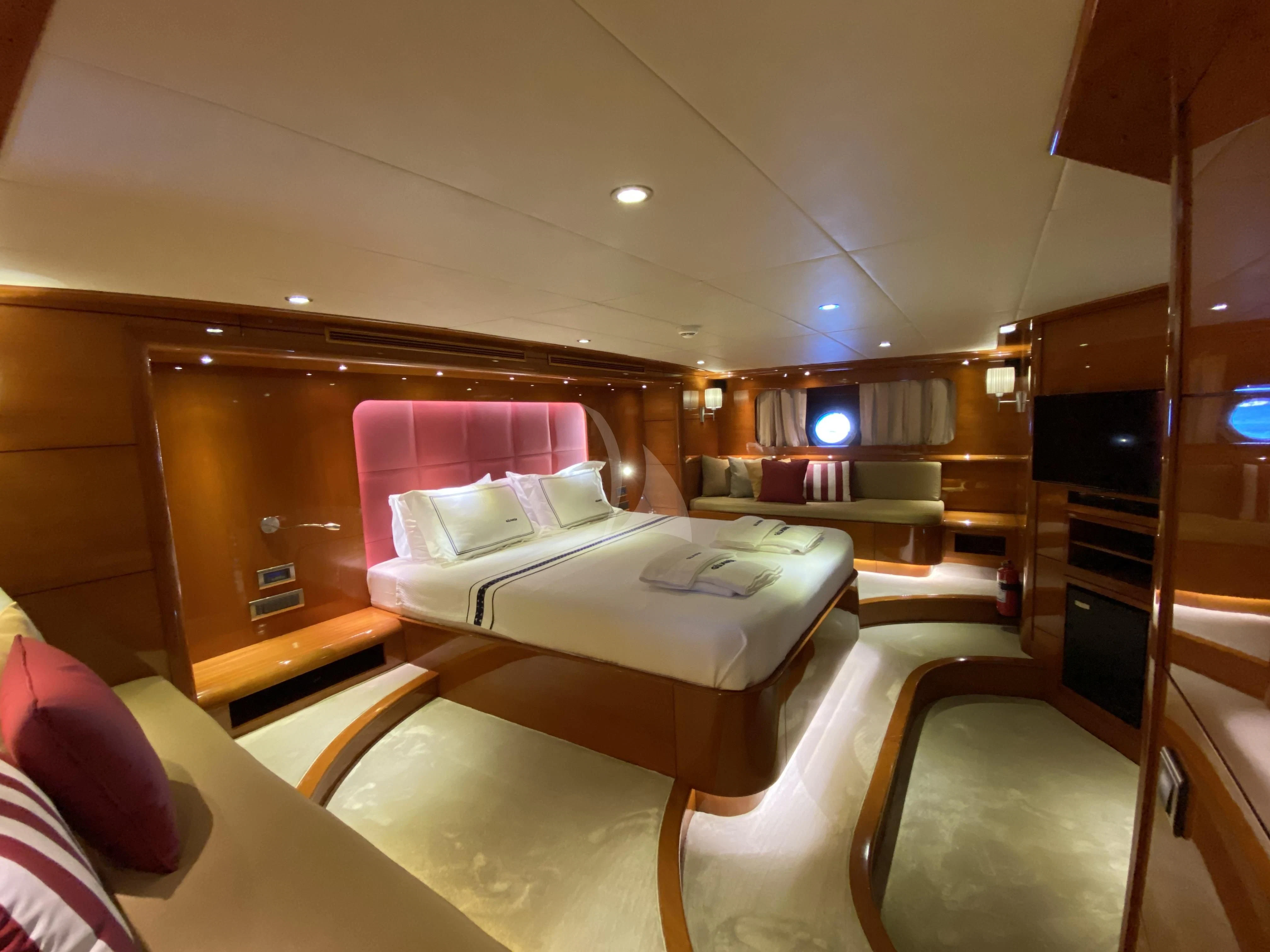 a room with a bed and a television aboard CANARIA Yacht for Sale