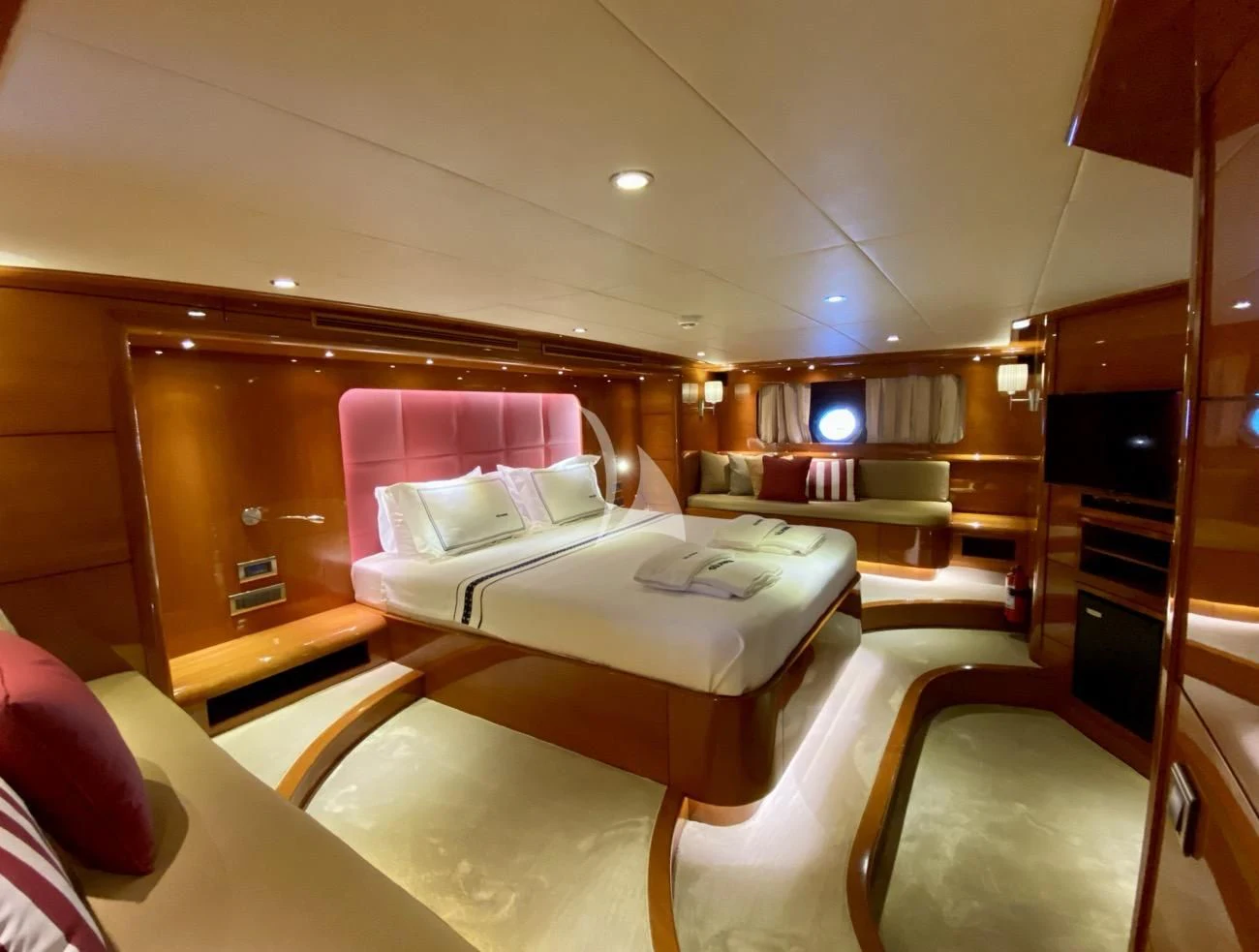 a room with a bed and a television aboard CANARIA Yacht for Sale