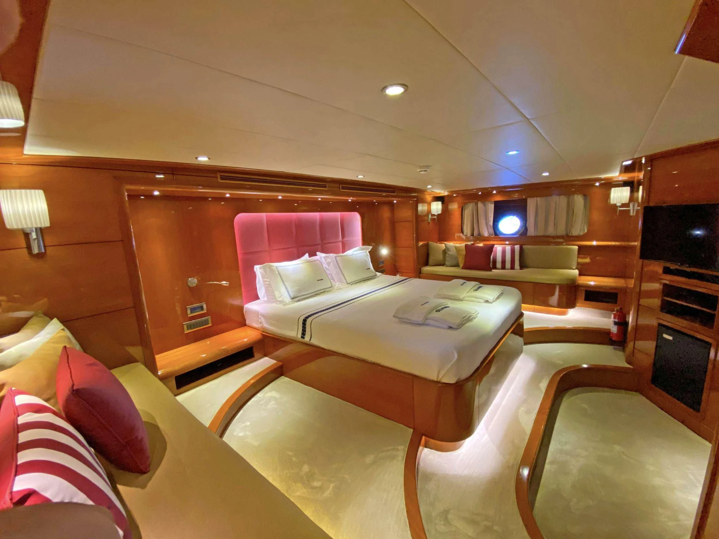 a room with a bed and a couch aboard CANARIA Yacht for Sale