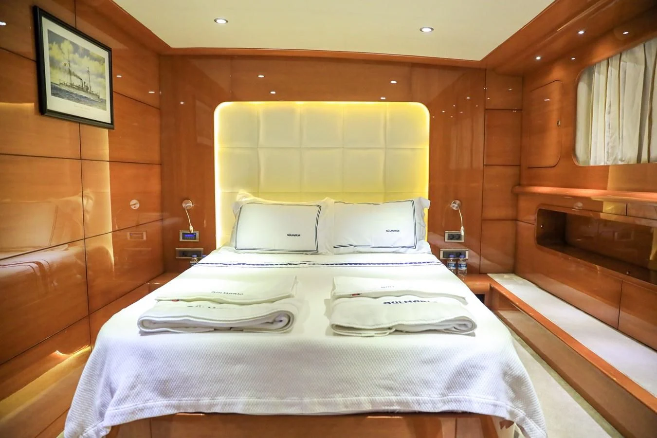a room with a bed and a window aboard CANARIA Yacht for Sale