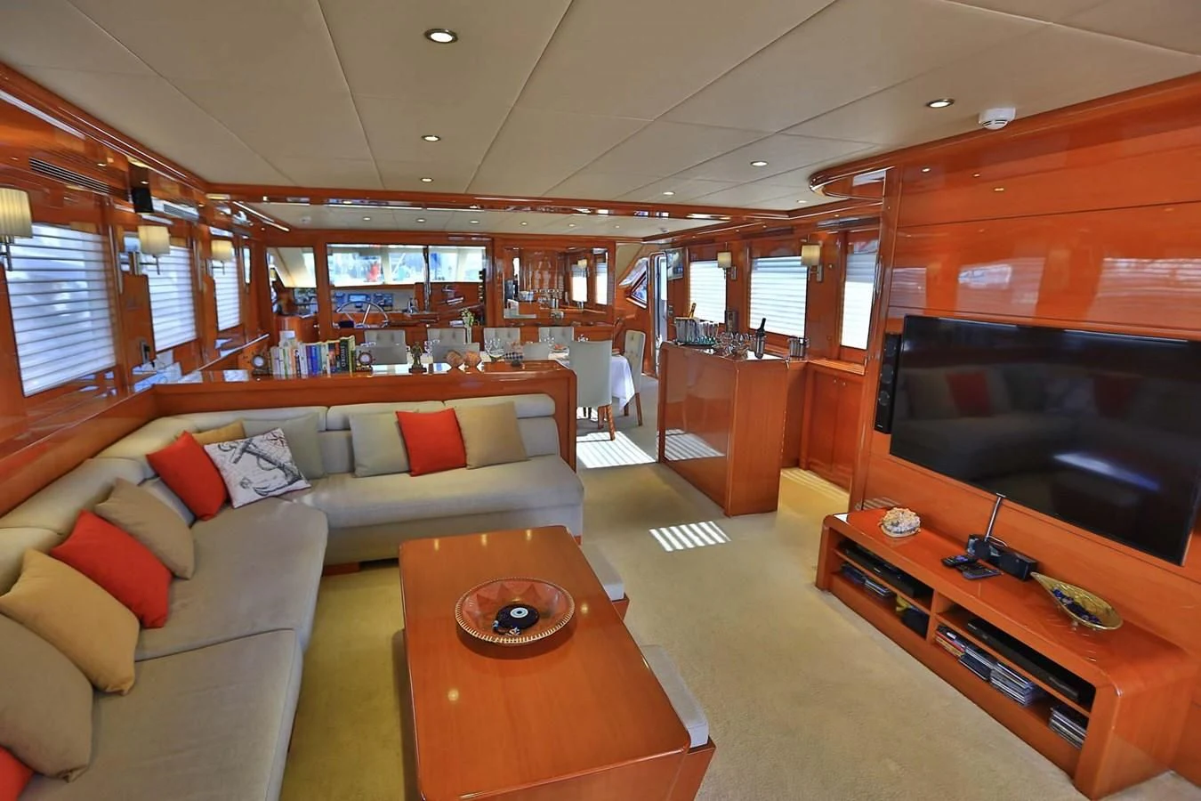 a living room with a couch and a coffee table aboard CANARIA Yacht for Sale