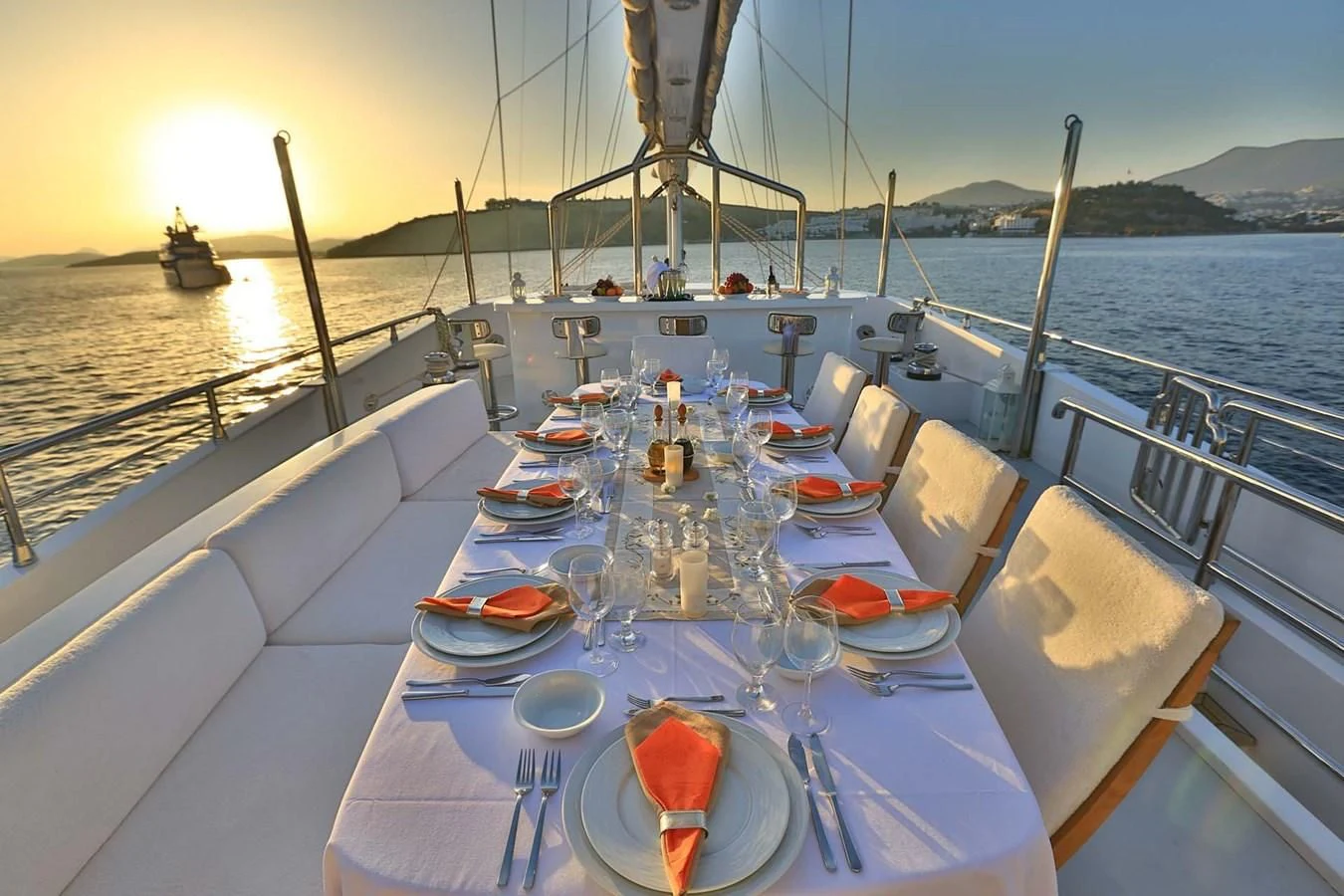 a table set for a dinner on a boat aboard CANARIA Yacht for Sale