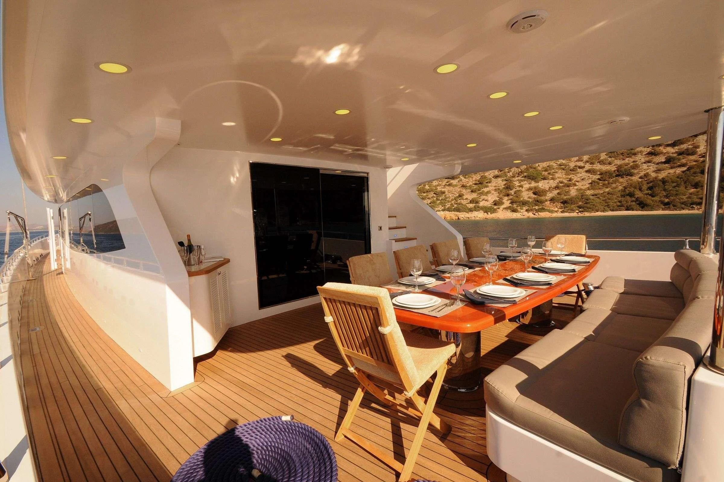 a living room with a large screen aboard CANARIA Yacht for Sale