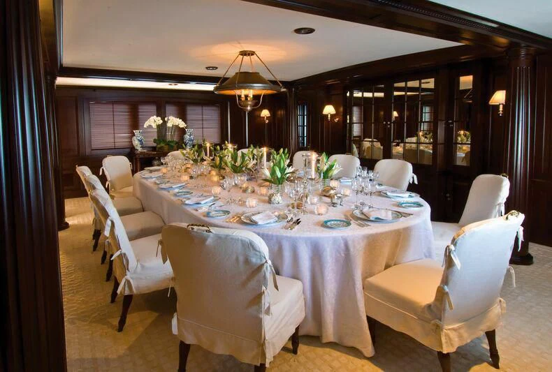 a dining room with a table set aboard VIRGINIAN Yacht for Sale