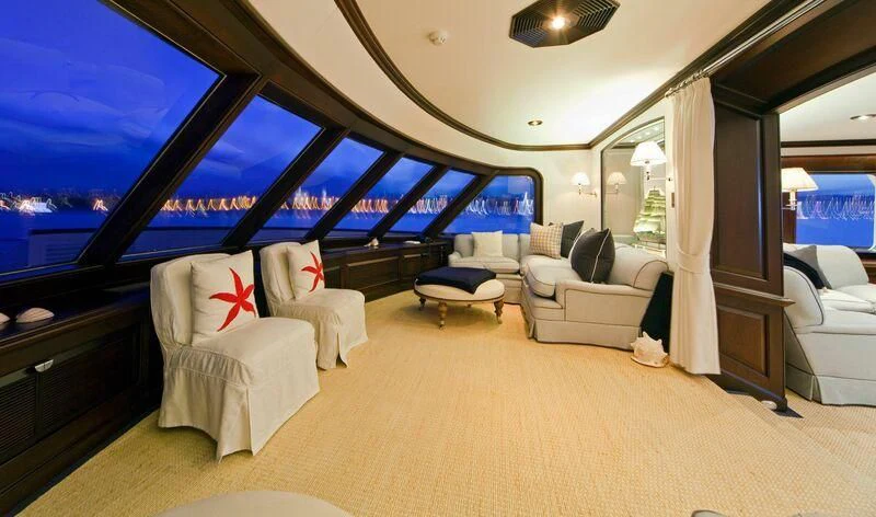 a room with a couch and a television aboard VIRGINIAN Yacht for Sale