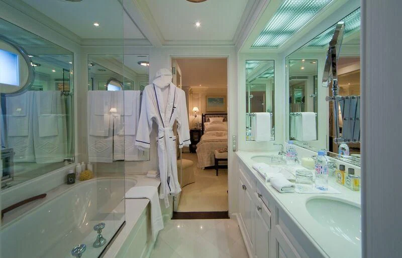 a bathroom with a large mirror aboard VIRGINIAN Yacht for Sale