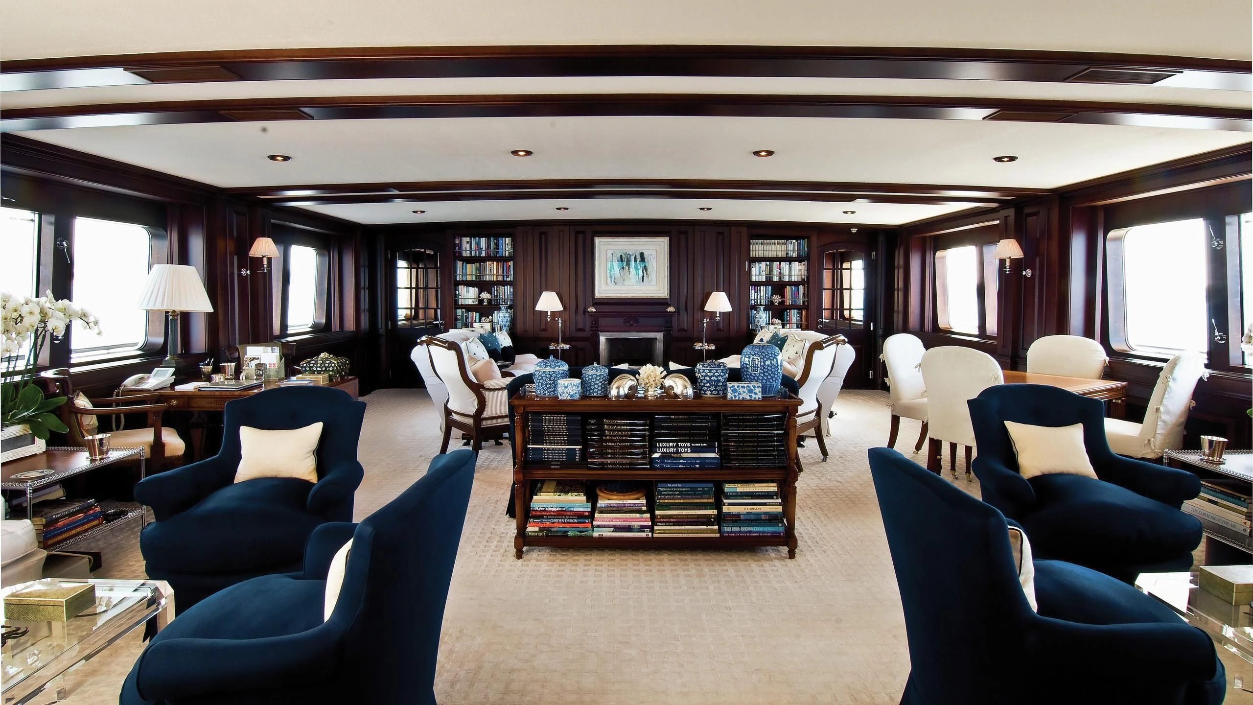 a large room with a large table and chairs aboard VIRGINIAN Yacht for Sale
