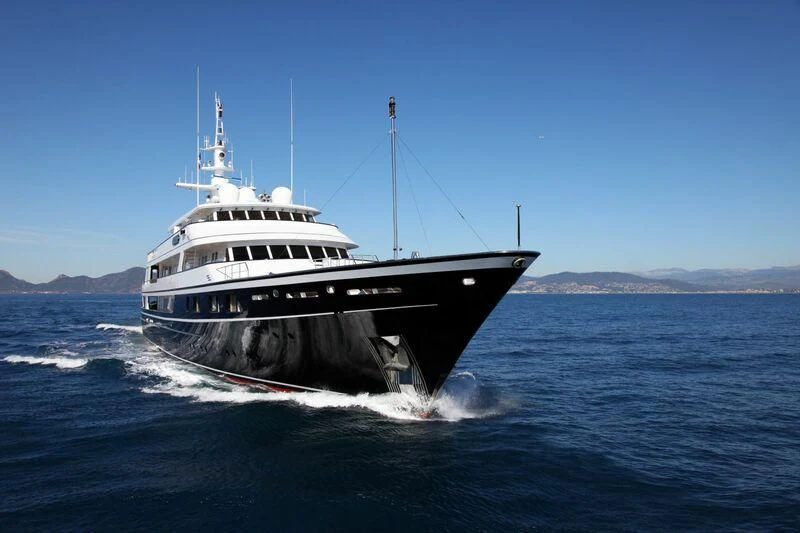 a large boat in the water aboard VIRGINIAN Yacht for Sale