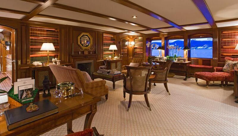 a living room with a large window aboard VIRGINIAN Yacht for Sale