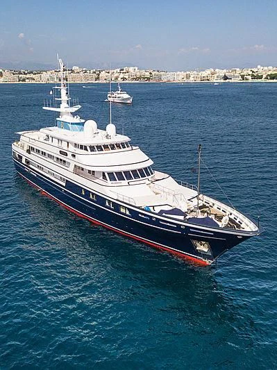 a large red and white boat in the water aboard VIRGINIAN Yacht for Sale