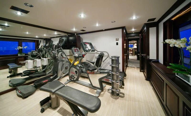 a room with a large mirror and several machines aboard VIRGINIAN Yacht for Sale