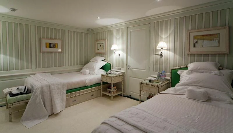 a room with two beds aboard VIRGINIAN Yacht for Sale