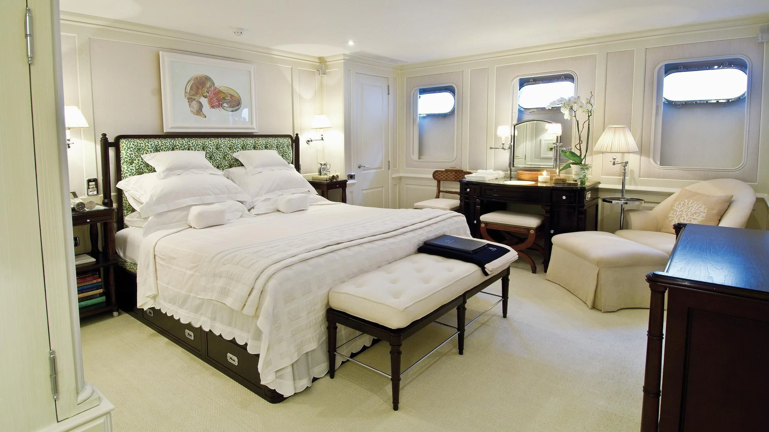 a bedroom with a bed and a desk aboard VIRGINIAN Yacht for Sale