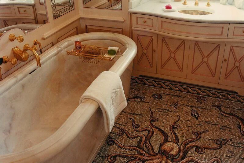 a bathtub with a sink and a faucet in a bathroom aboard VIRGINIAN Yacht for Sale