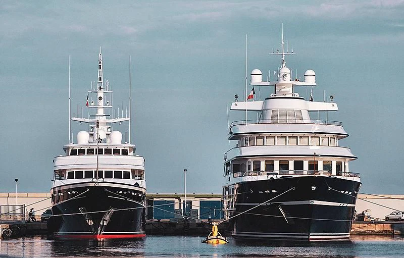 a couple of large boats sit in the water aboard VIRGINIAN Yacht for Sale