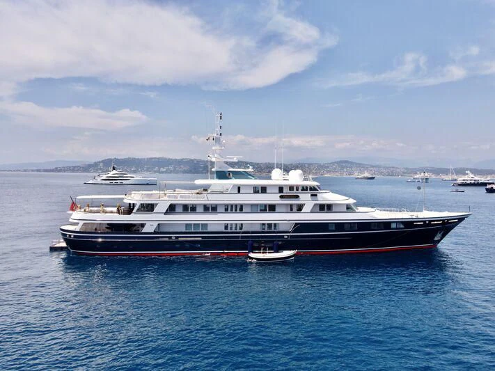 a large white boat in the water aboard VIRGINIAN Yacht for Sale