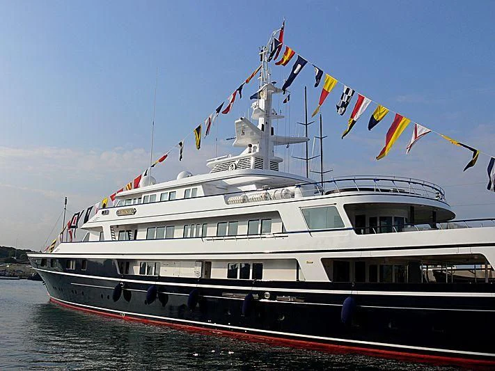 a large boat on the water aboard VIRGINIAN Yacht for Sale