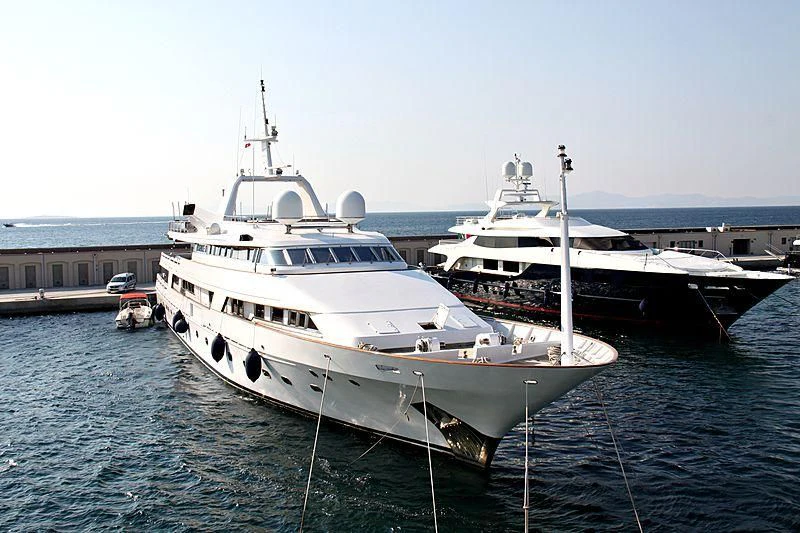 a couple of boats sit in the water aboard DARNICE III Yacht for Sale