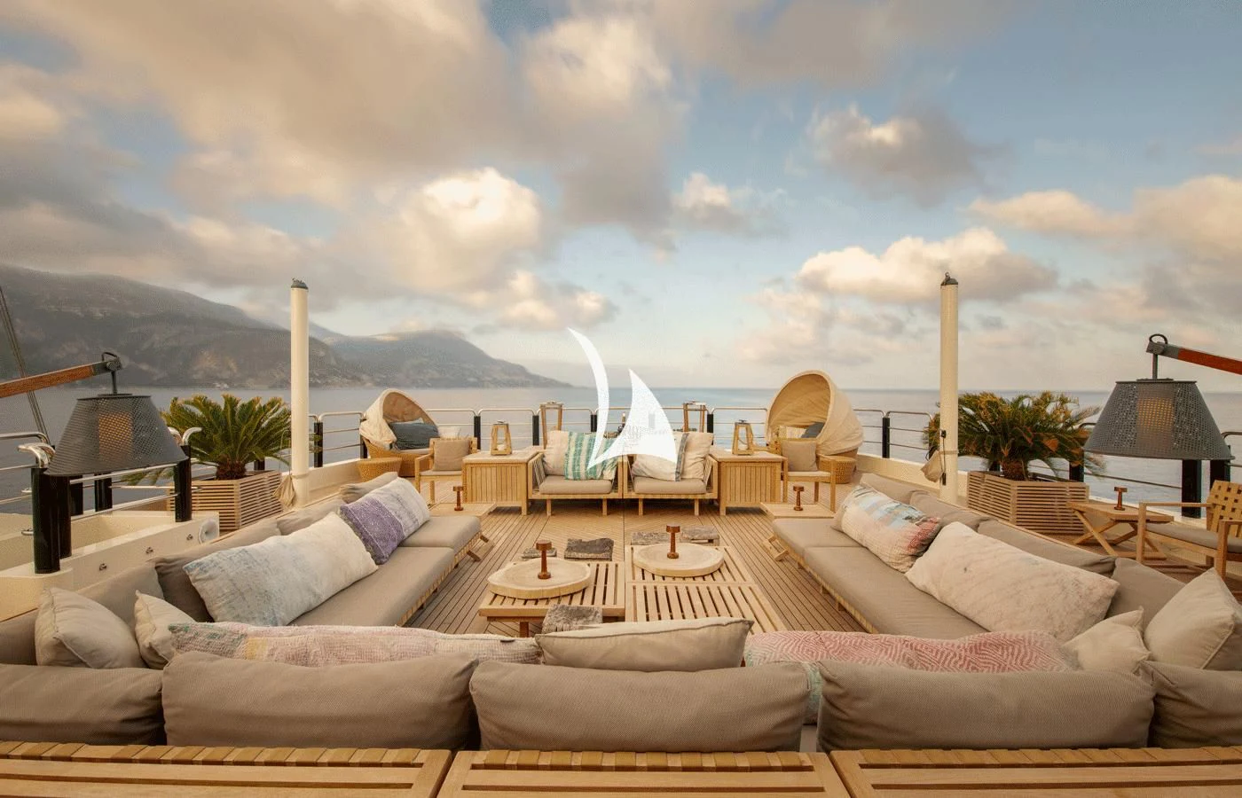 a large living room with a large body of water and a beach aboard ARBEMA Yacht for Sale