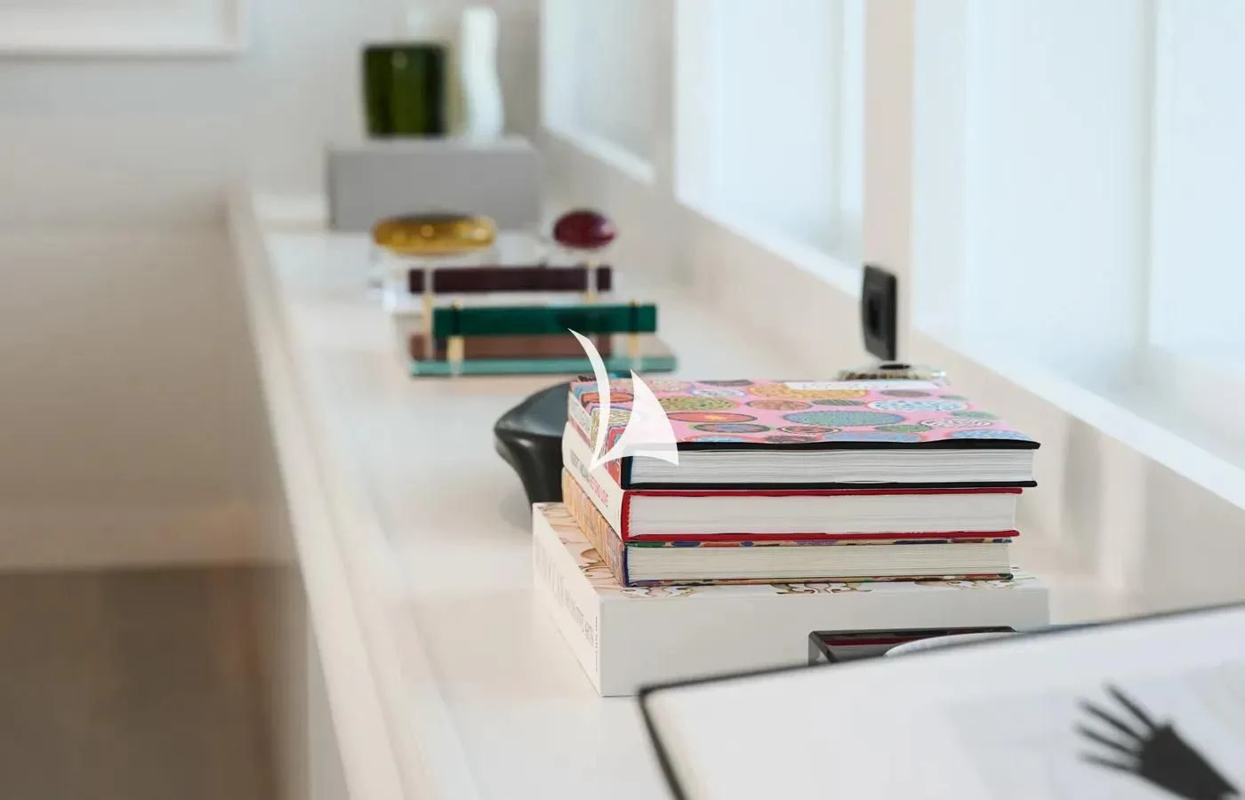 a table with a stack of papers on it aboard ARBEMA Yacht for Sale