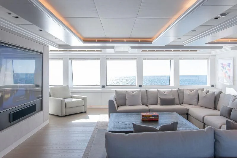 a living room with a large screen aboard ARBEMA Yacht for Sale