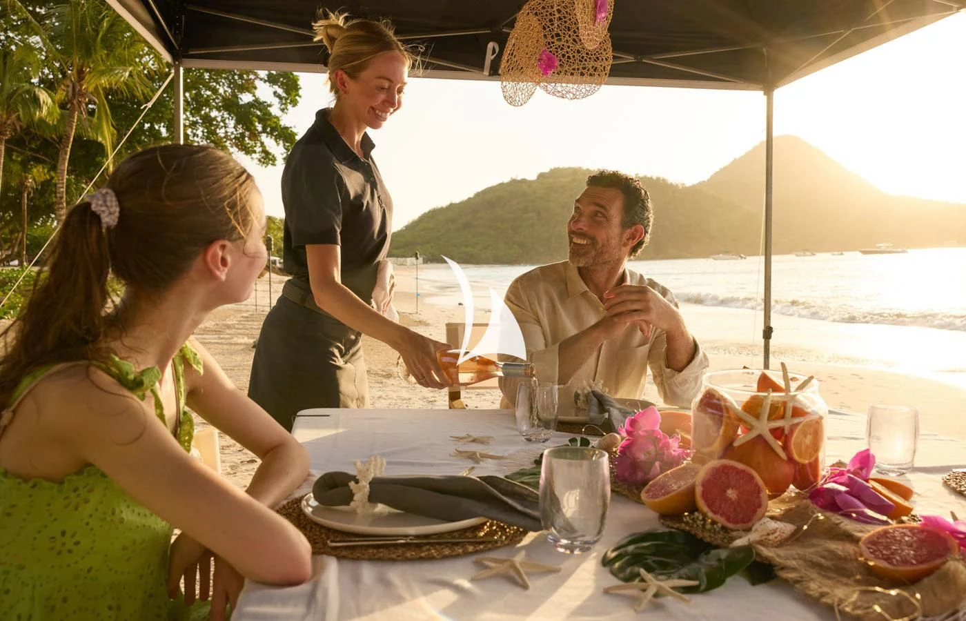 a group of people sitting at a table outside aboard ARBEMA Yacht for Sale