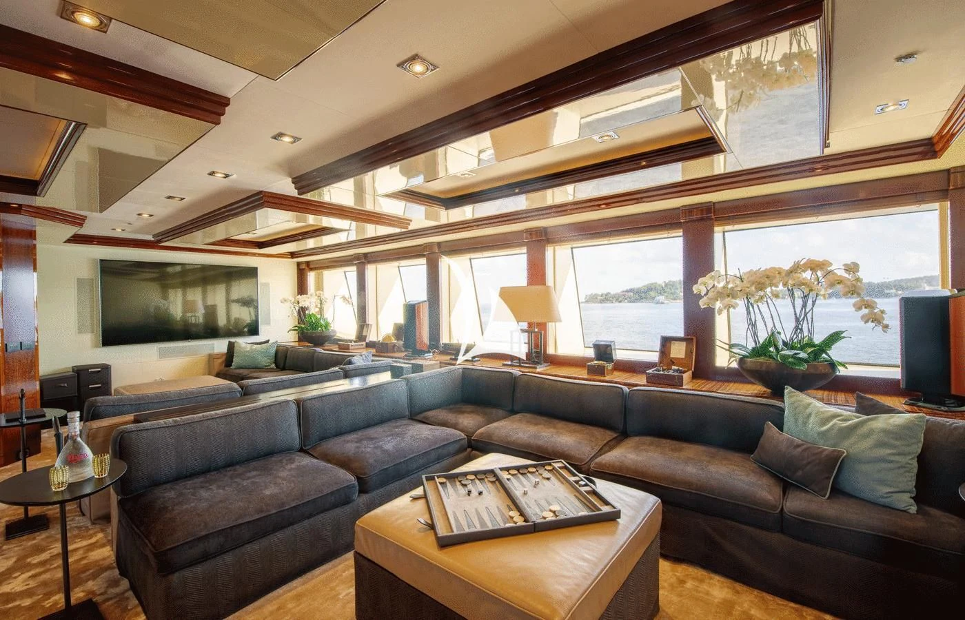 a living room with a leather couch aboard ARBEMA Yacht for Sale