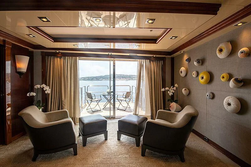 a room with a table chairs and a window aboard ARBEMA Yacht for Sale