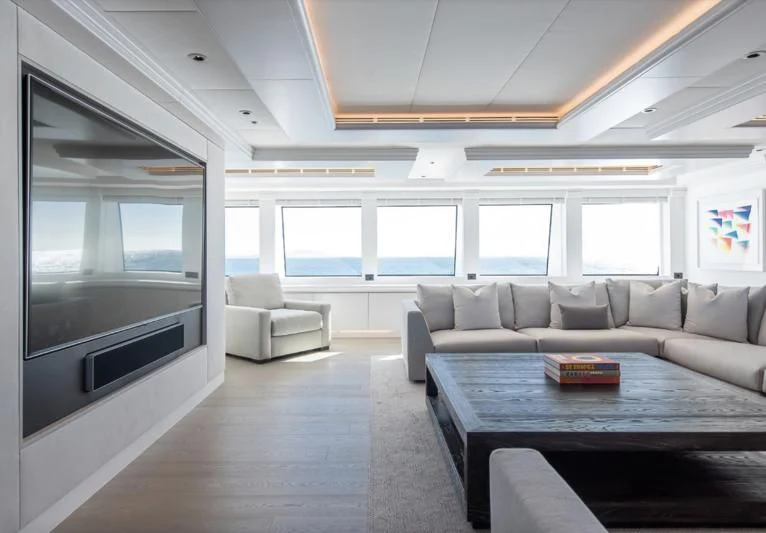 a living room with a large window aboard ARBEMA Yacht for Sale