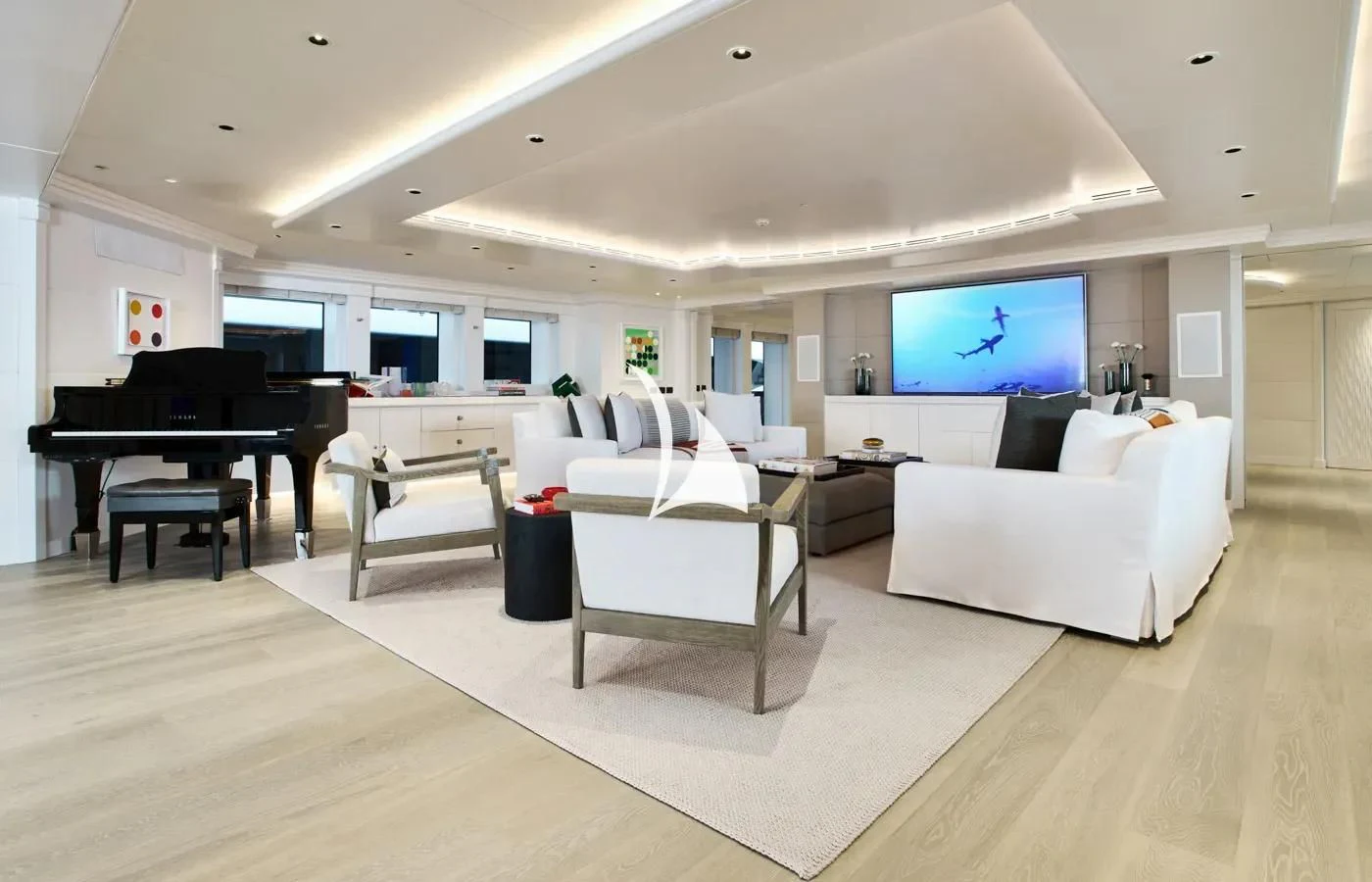 a living room with a large screen aboard ARBEMA Yacht for Sale