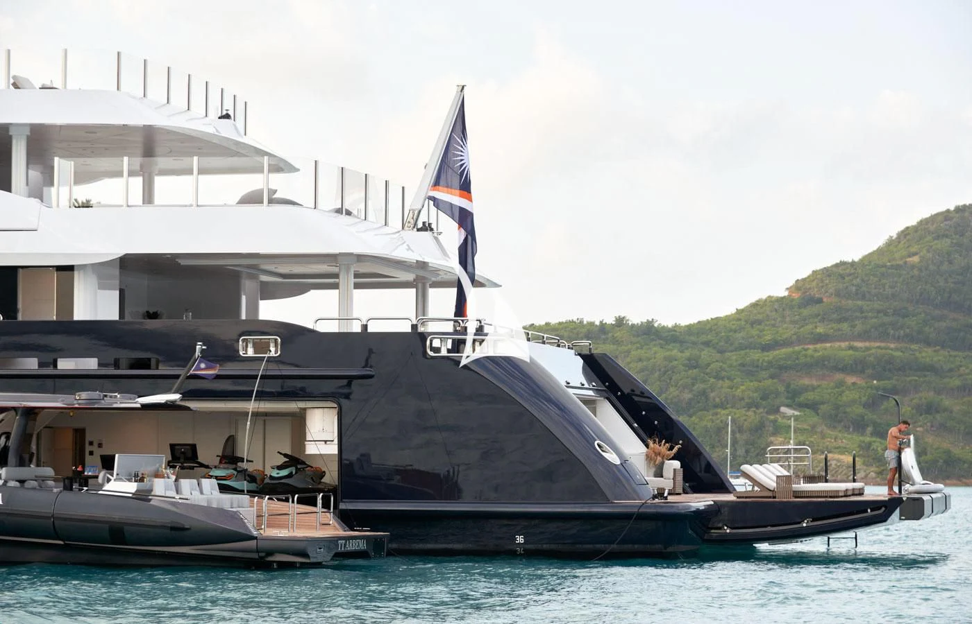 a boat with a flag on it aboard ARBEMA Yacht for Sale