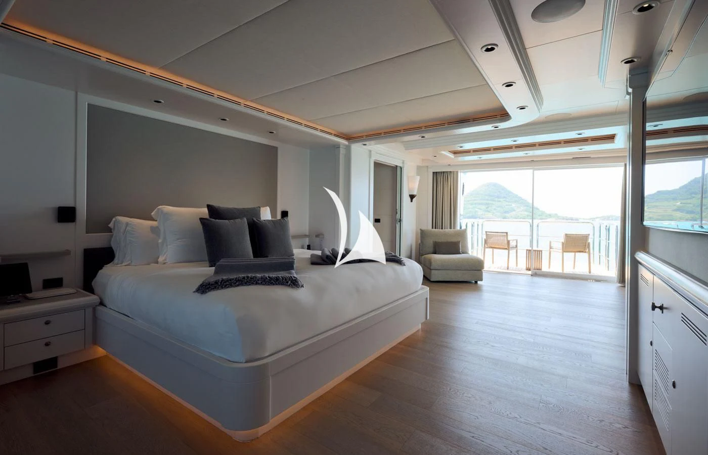 a large bedroom with a large bed aboard ARBEMA Yacht for Sale