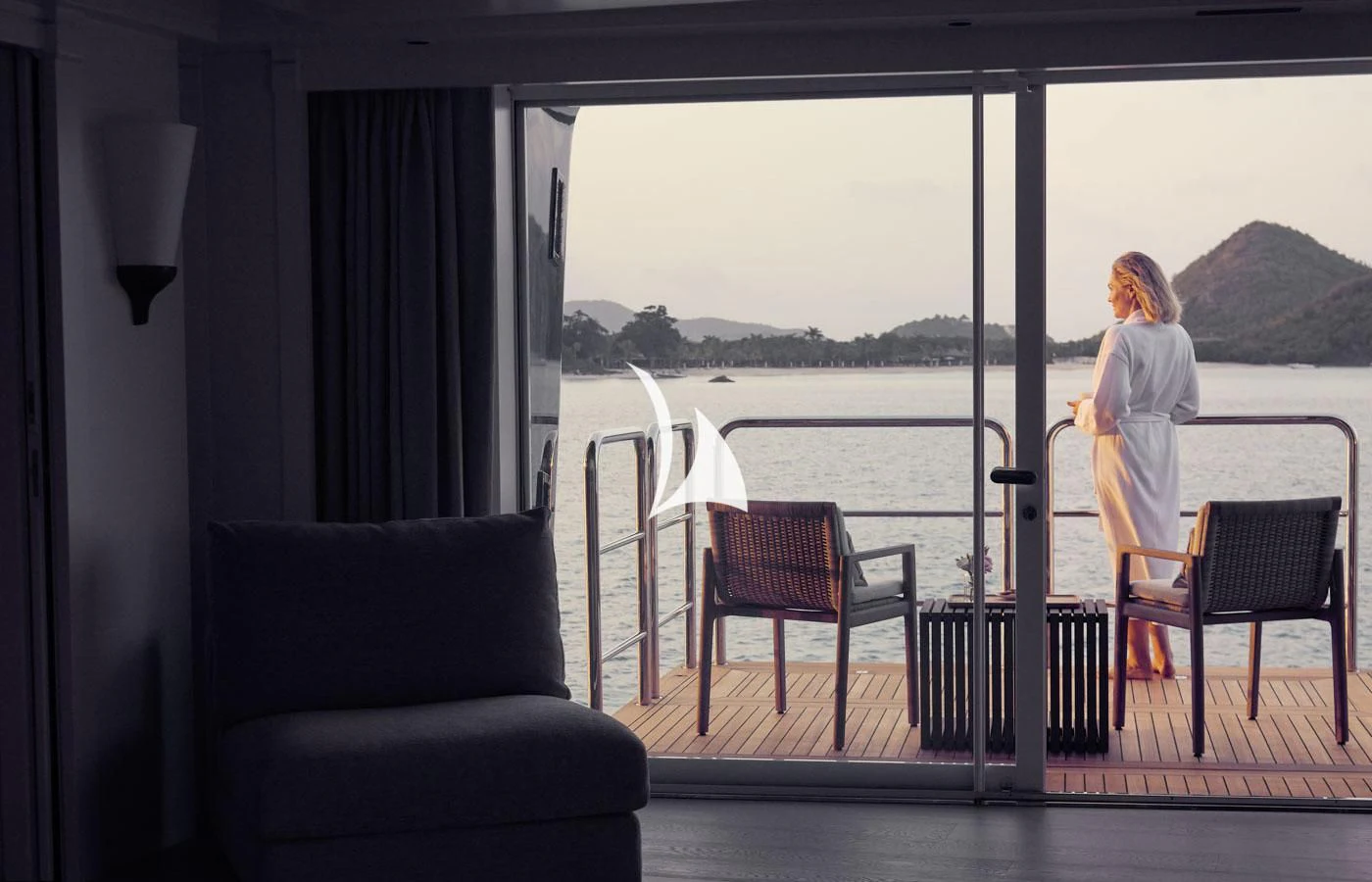 a person standing outside a window aboard ARBEMA Yacht for Sale