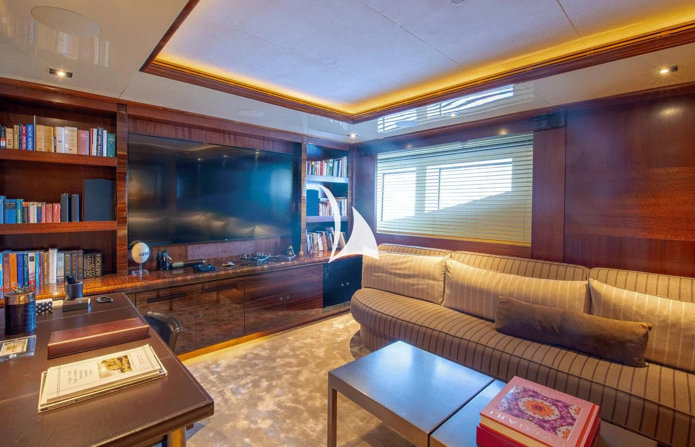 a living room with a couch and a tv aboard ARBEMA Yacht for Sale