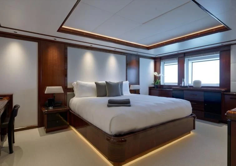 a large bedroom with a large bed aboard ARBEMA Yacht for Sale