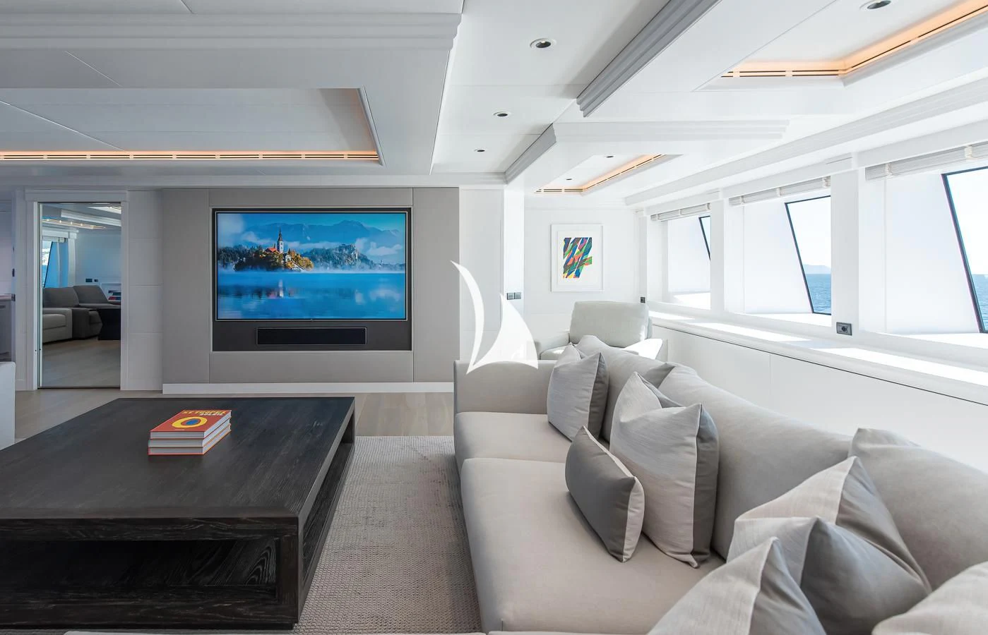 a living room with a large screen aboard ARBEMA Yacht for Sale