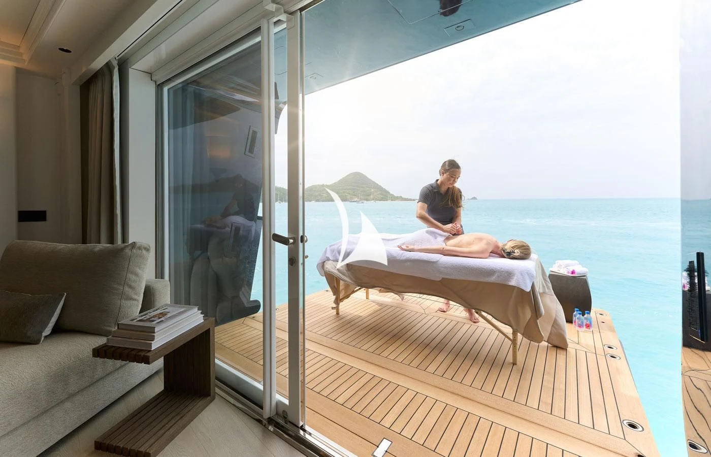 a person sitting on a bed aboard ARBEMA Yacht for Sale