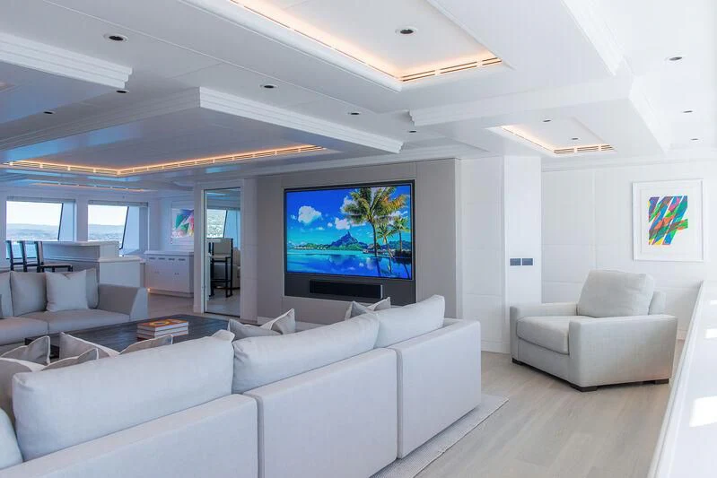 a living room with a large screen aboard ARBEMA Yacht for Sale