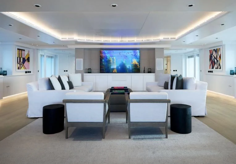 a living room with white couches aboard ARBEMA Yacht for Sale