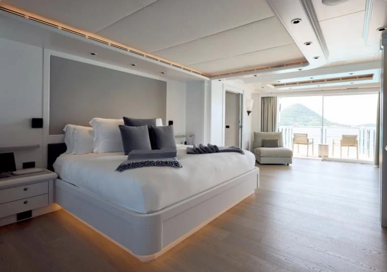 a large bedroom with a large bed aboard ARBEMA Yacht for Sale